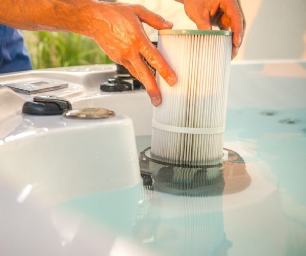 Hot Tub Technician removing a water filter.